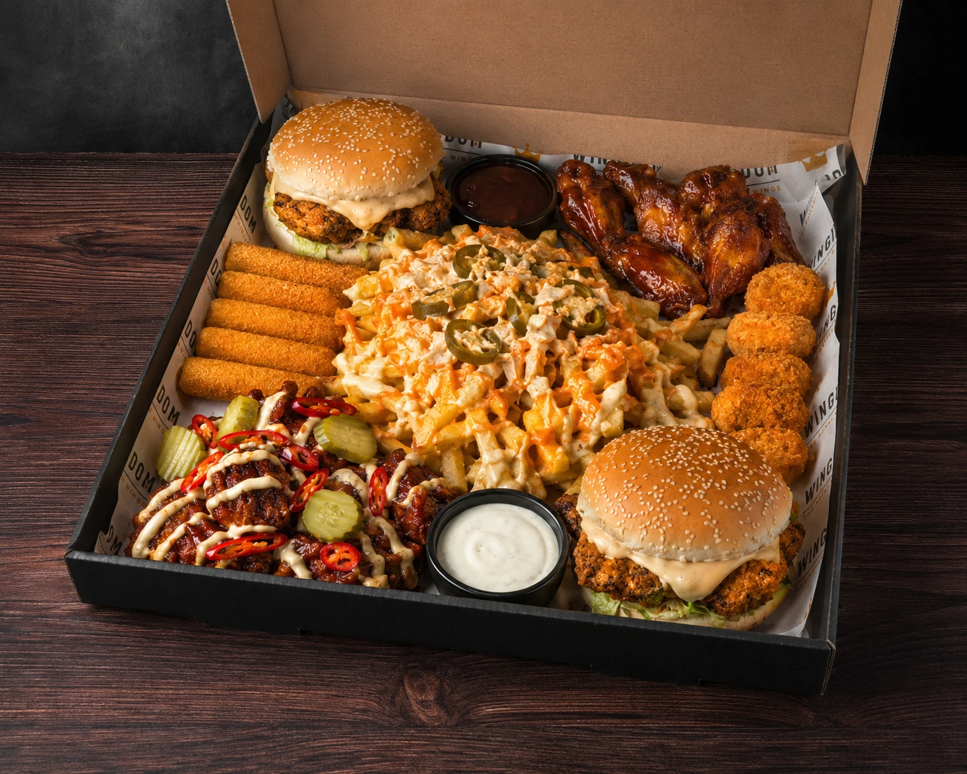 Wingdom sharing box with burgers, wings, fries, sides and dips